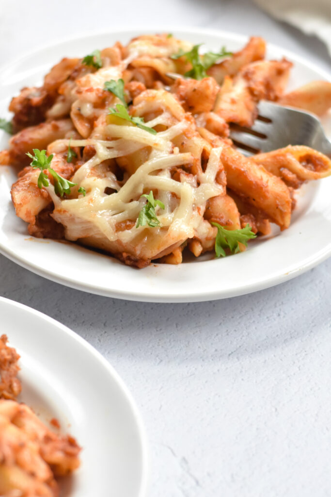 A classic Midwestern inspired casserole—Vegan Baked Mostaccioli is an easy baked pasta recipe featuring Mostaccioli noodles, spicy vegan sausage, marinara sauce, and vegan cheese.