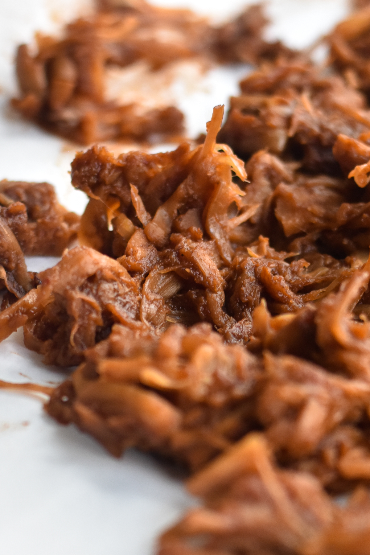 Jackfruit slow cooks in BBQ sauce and spices. This vegan pulled pork alternative makes a great vegan pulled pork sandwich.