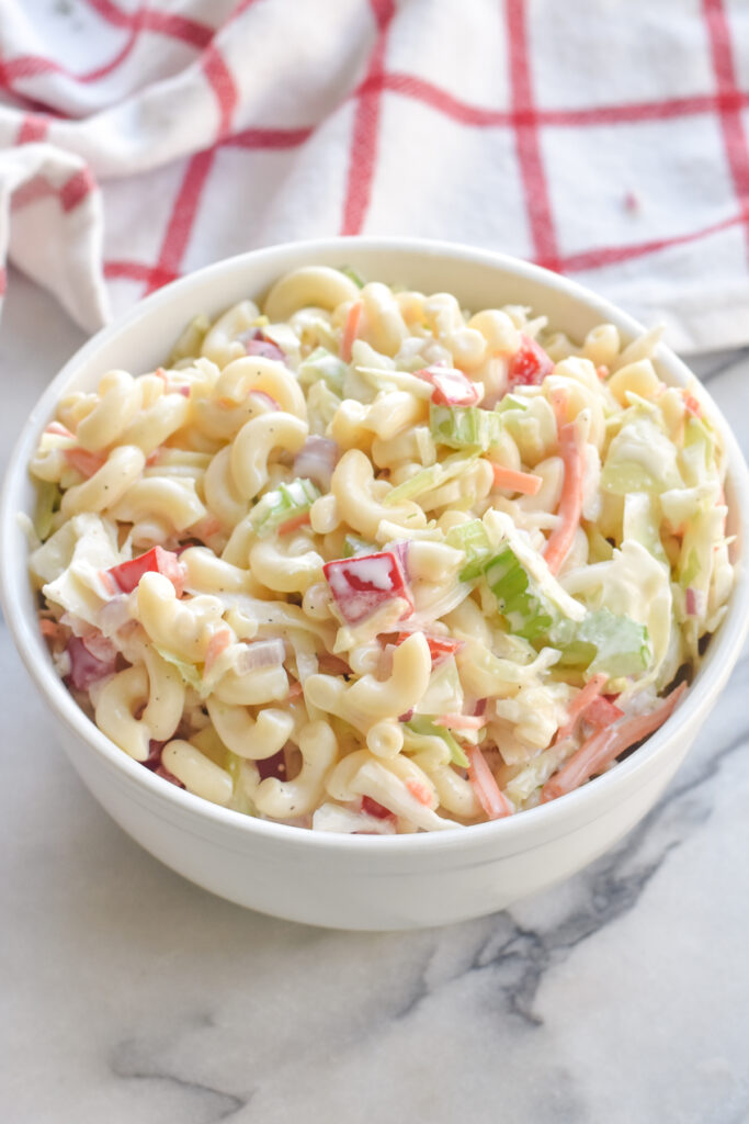 Coleslaw Macaroni Salad combines the best side dishes—coleslaw and macaroni salad. This the perfect side dish for Summer potlucks and BBQs. 
