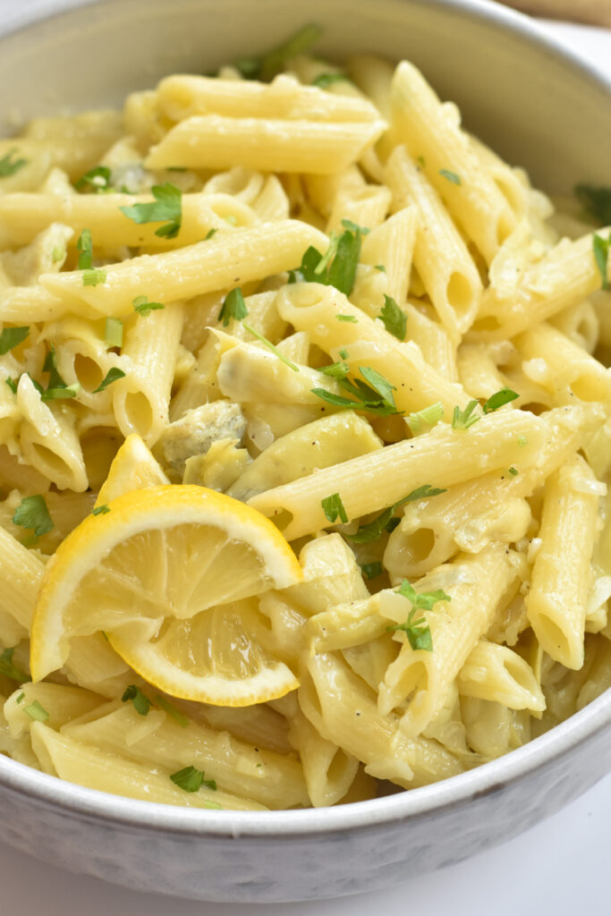 This simple, delicious Vegan Artichoke Pasta is made with vegan butter, lemon, and lots of Vegan Parmesan. And this pasta is made with canned artichoke hearts so you can enjoy it year-round.
