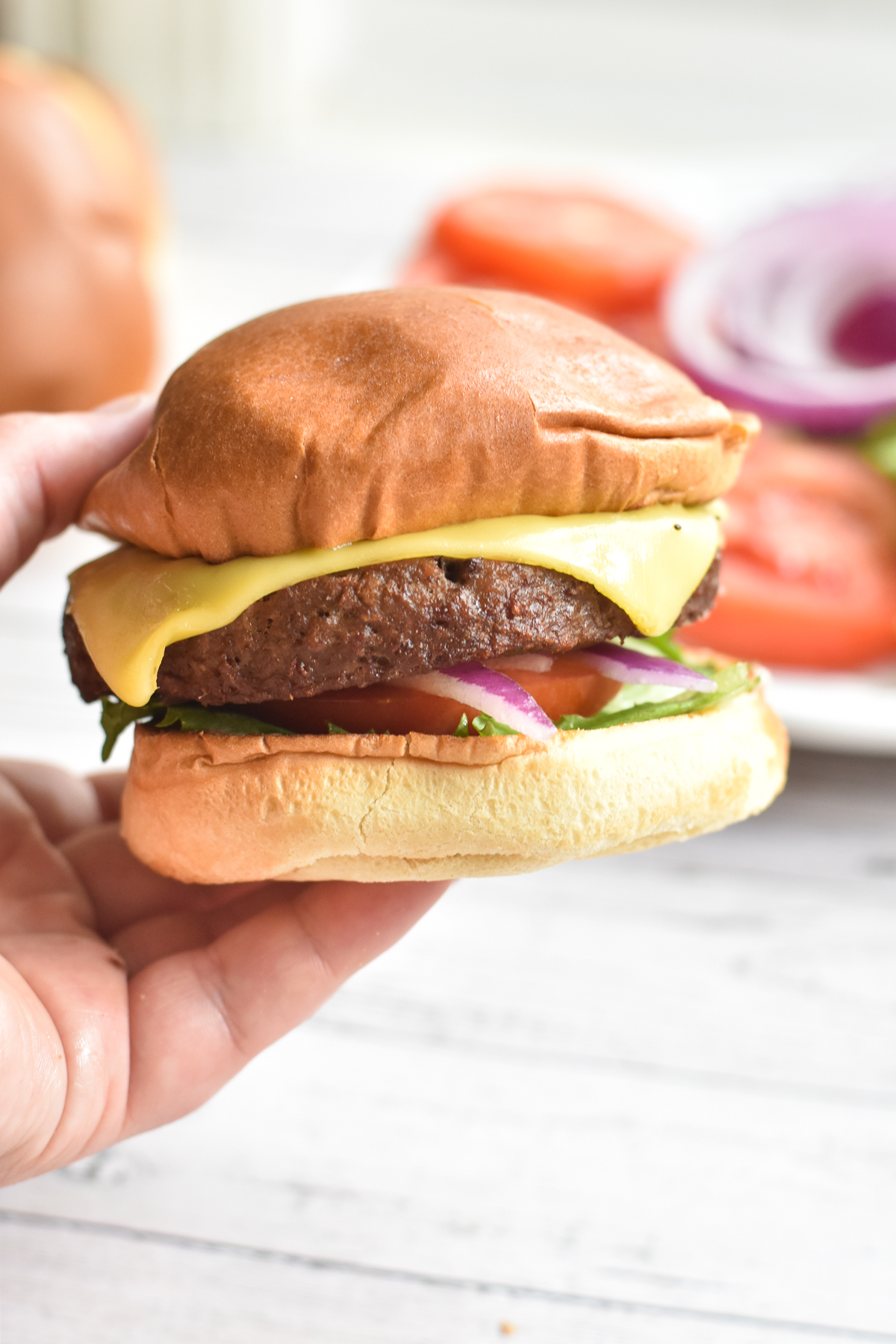 Air Fryer Impossible Burgers are perfect for burger night! It's so easy to make vegan burgers in the air fryer.