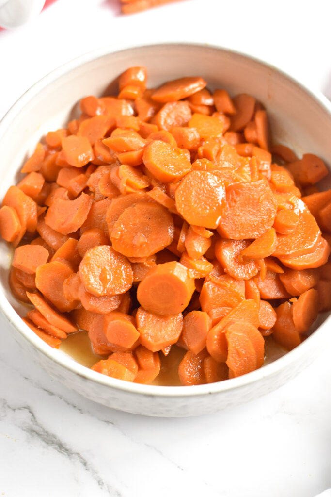 These dairy-free slow cooker glazed carrots are the perfect side dish for  for Thanksgiving dinner or a weeknight dinner. 