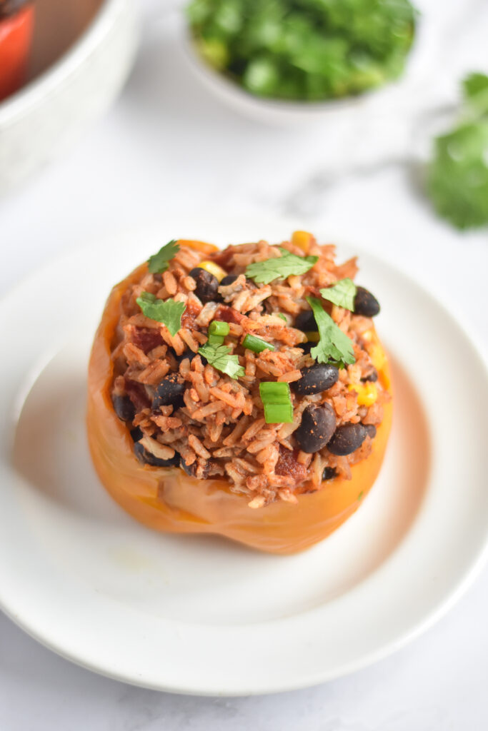 Healthy, flavorful stuffed peppers willed a Tex-Mex plant-based filling made with rice and beans. 