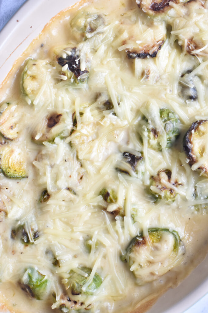 Cheesy creamy brussels sprout casserole is an easy vegetable side dish featuring roasted brussel sprouts cooked in a cheese sauce.  