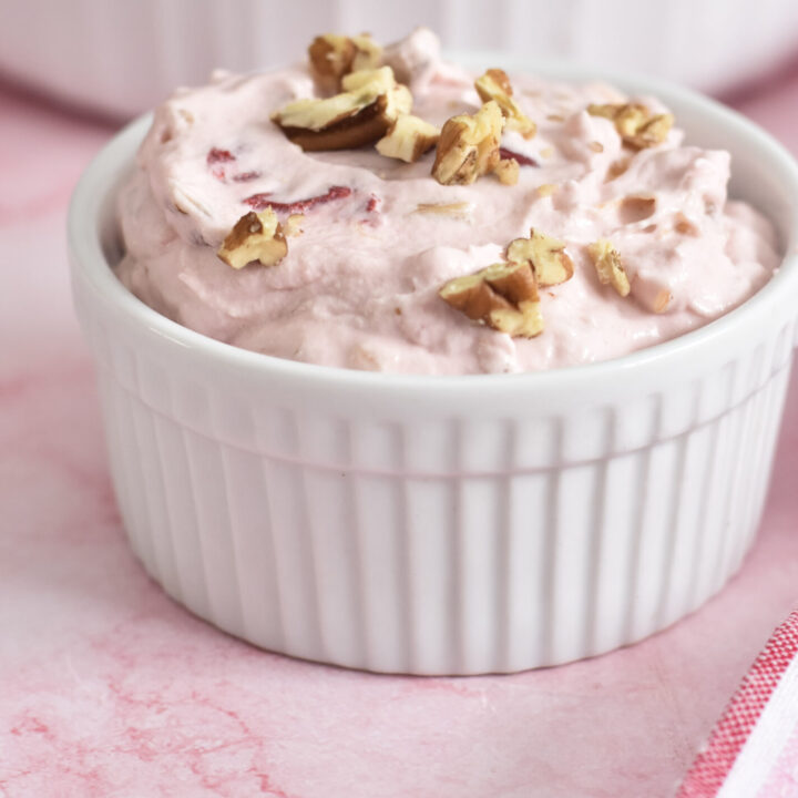 individual serving of cherry pink fluff with chopped pecans